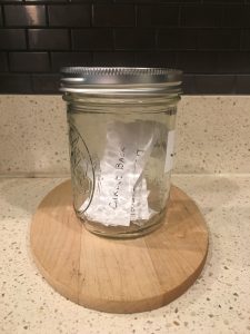 Image of a sealed Jargon Jar, with papers inside that contain jargon buzzwords and phrases. Best-in-breed will be today's entry.